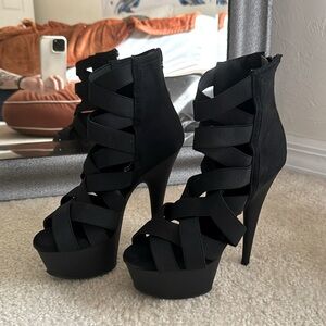 Strappy black pleaser heels.
